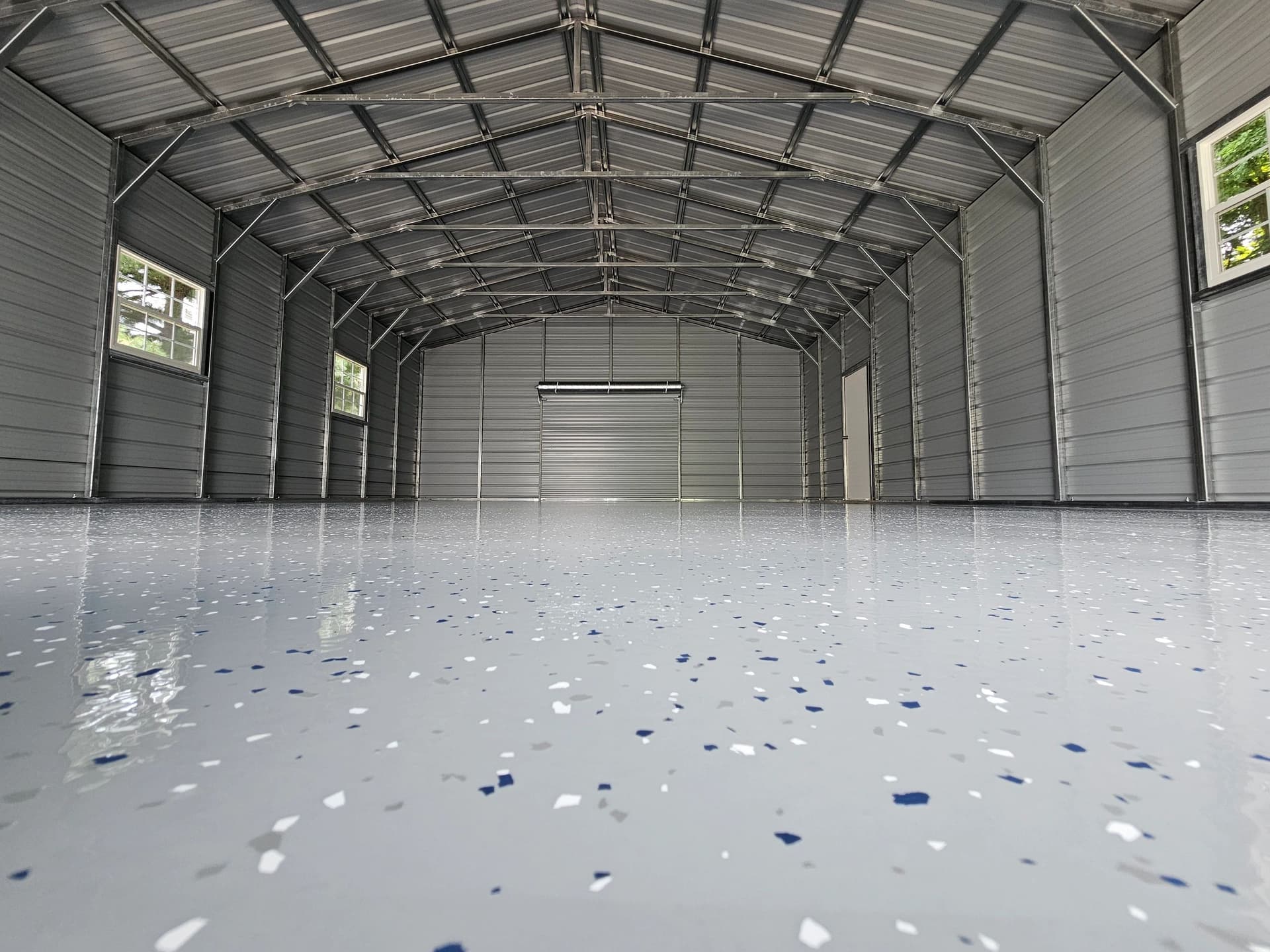 Wide flake epoxy floor with a mirror-like finish